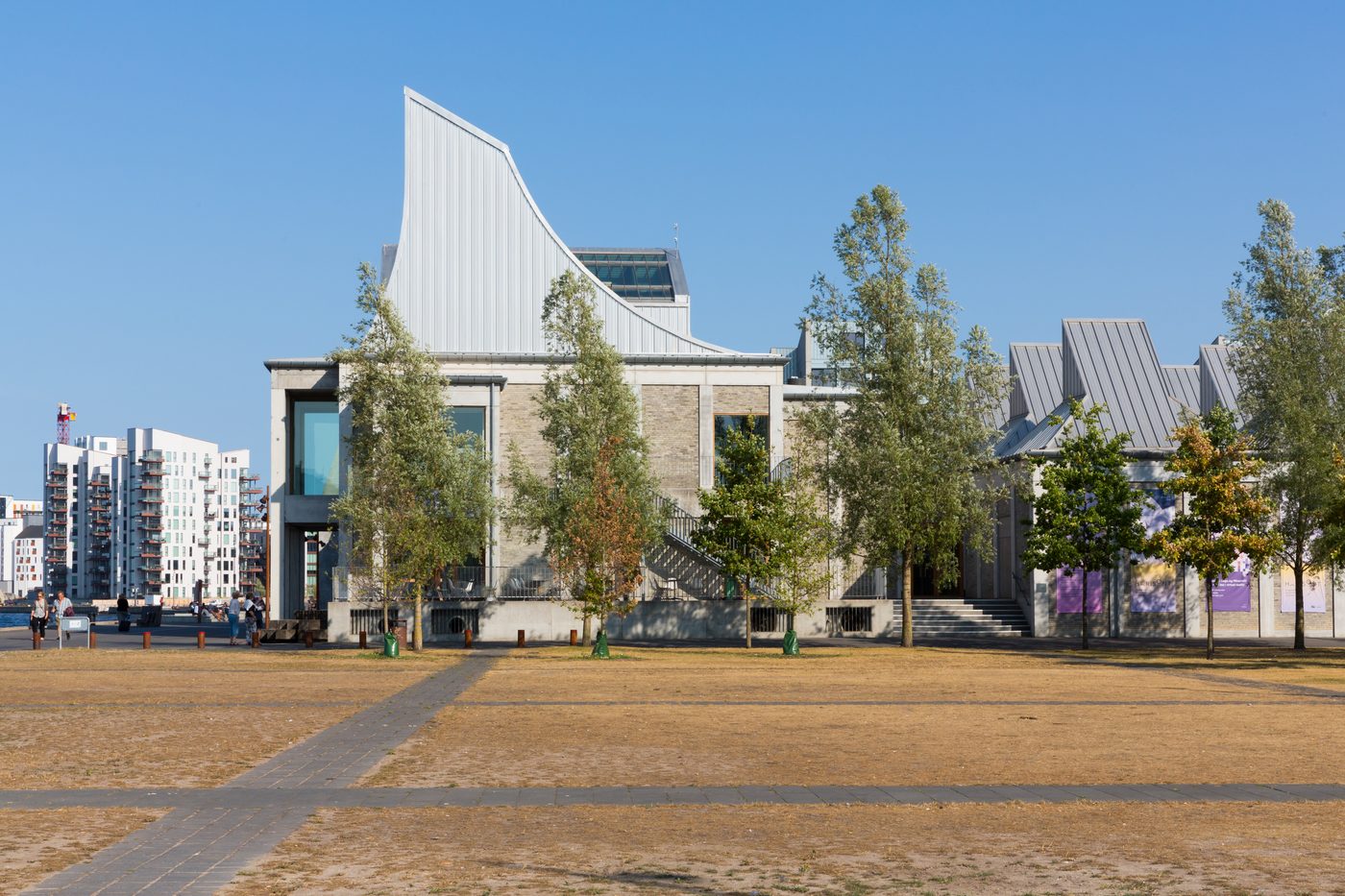 The Utzon Center on the Aalborg waterfront — white concrete vaults and copper roof