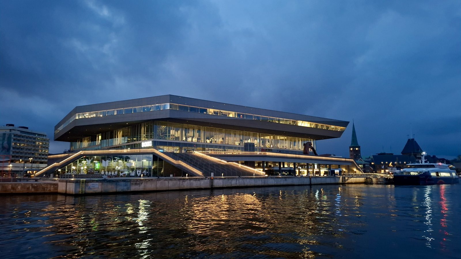 Aarhus harbour with the Dokk1 library and a Samsø passenger ferry leaving the quay
