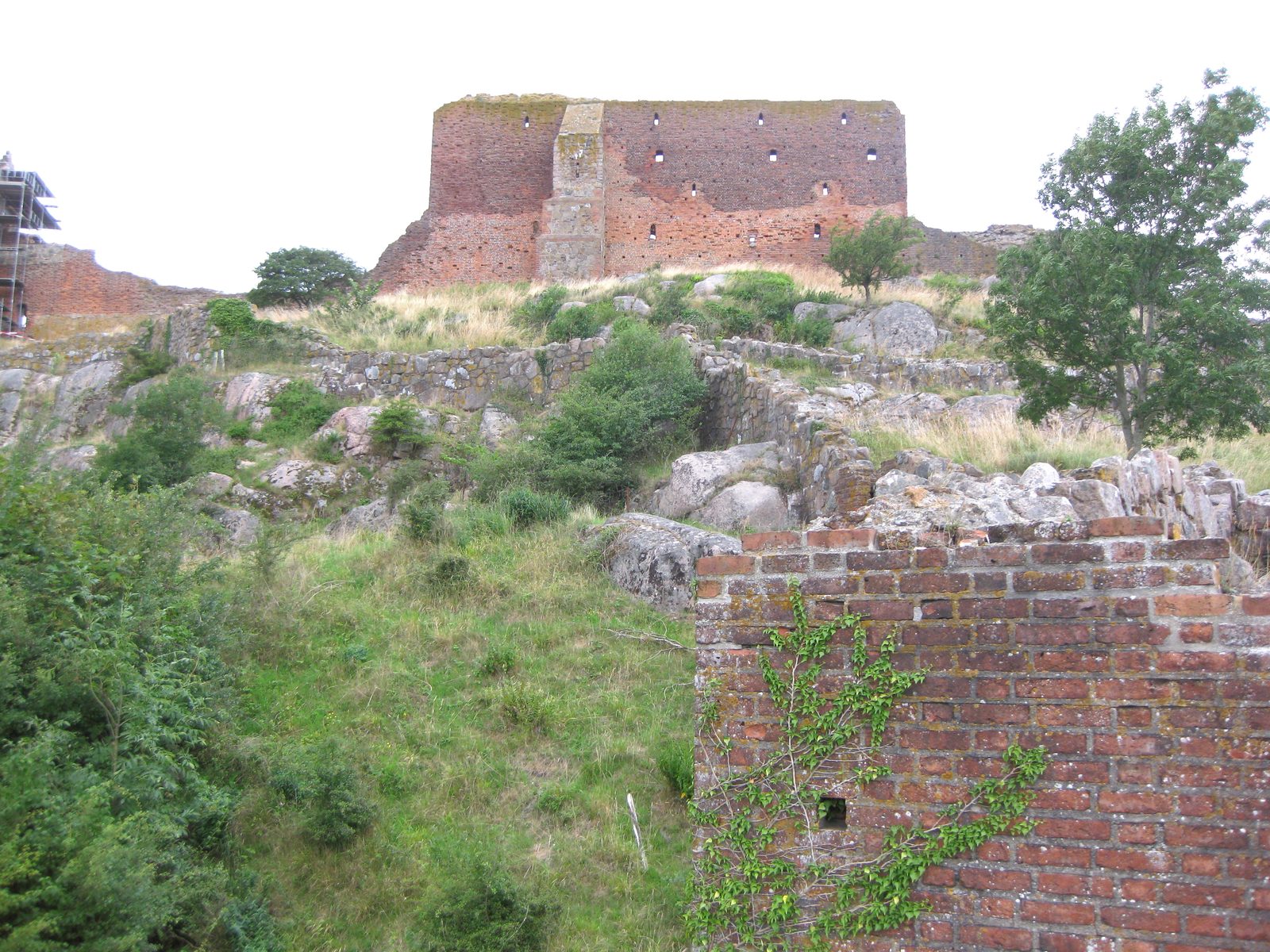 Hammershus castle ruin at dusk, perched on its granite headland with the Baltic on three sides