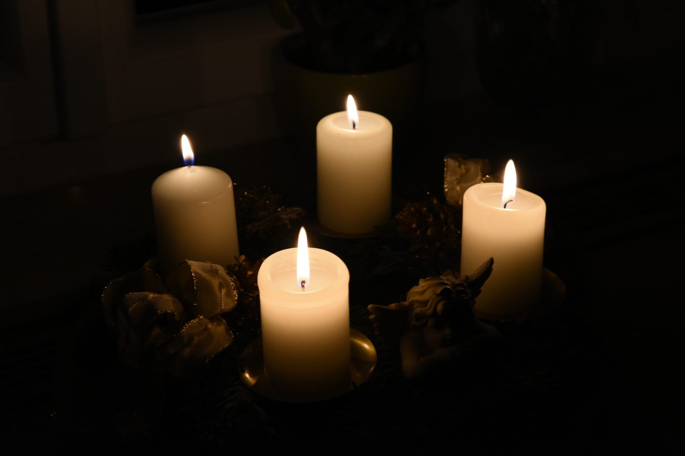 A traditional advent wreath with four candles, two of them lit