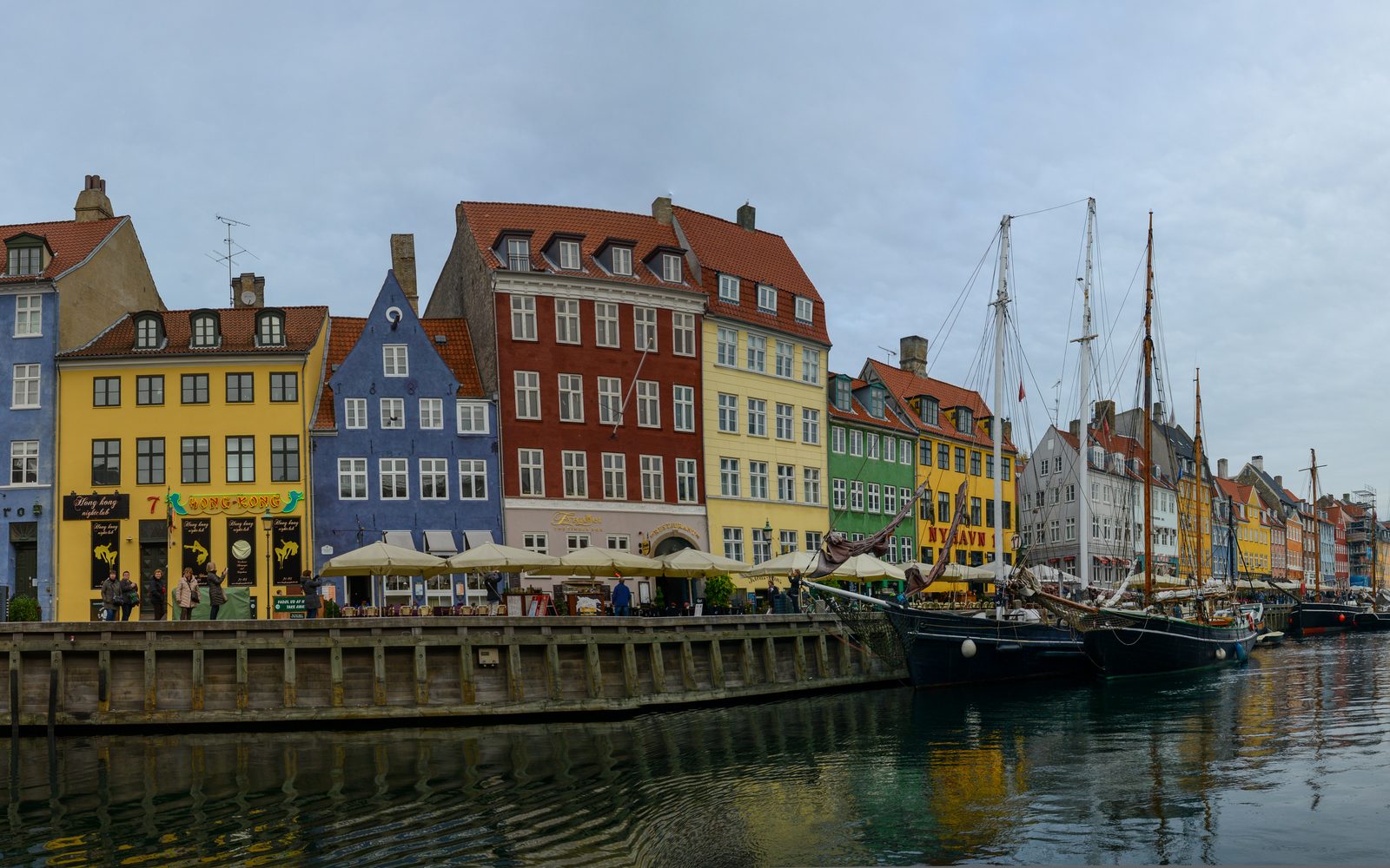 Nyhavn at golden hour — colourful 17th-century façades and reflected water