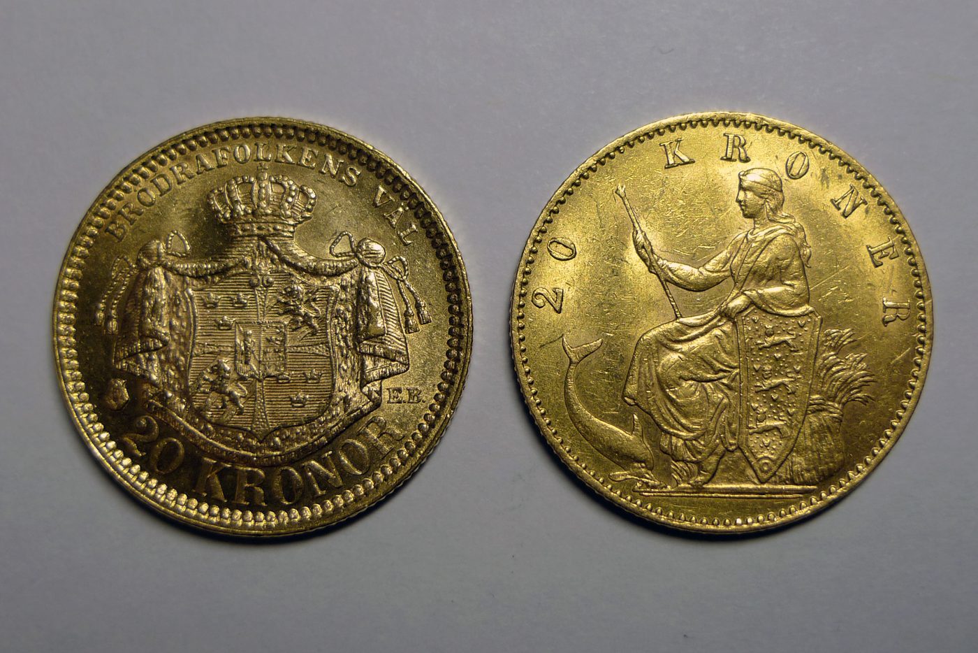 Two gold-coloured 20-kroner Danish coins