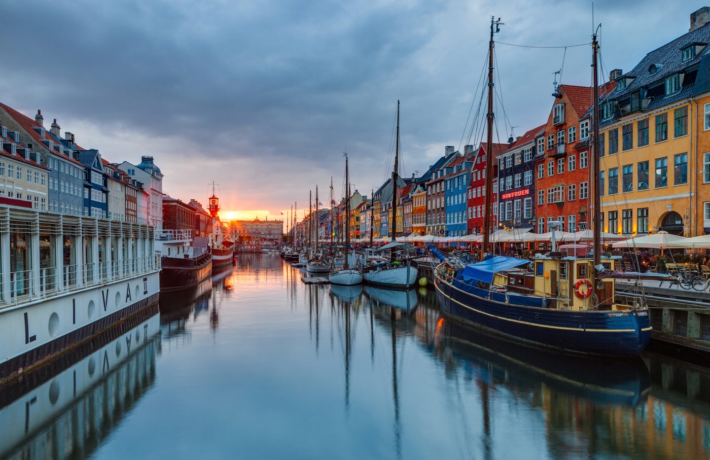 Nyhavn in Copenhagen at sunset — the painted townhouses and old wooden boats