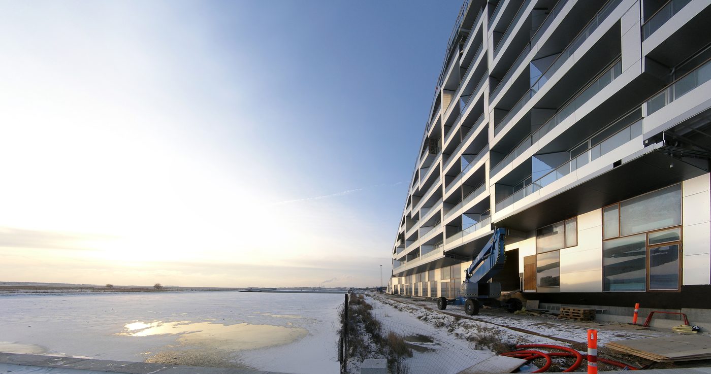 The 8 House (8tallet) by Bjarke Ingels in Ørestad, Copenhagen — a figure-eight residential block with a continuous bikeable ramp