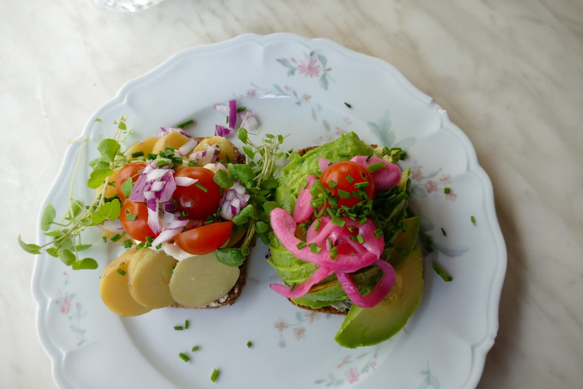 Open-faced Danish smørrebrød with herring and rye