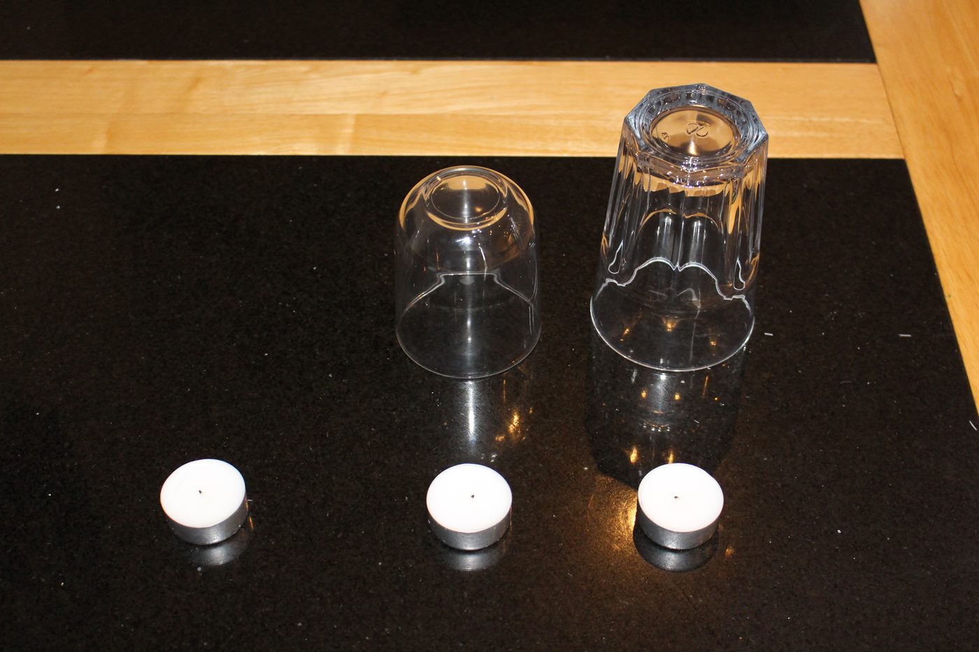 Tealights on a Danish dinner table — the warm low light Danes default to