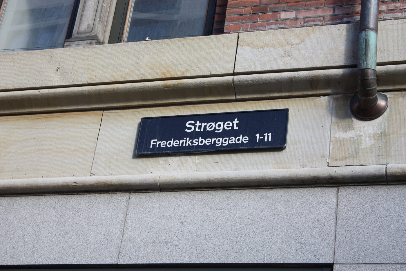 The pedestrian shopping street Strøget in central Copenhagen, lined with Danish shop signs and brand names