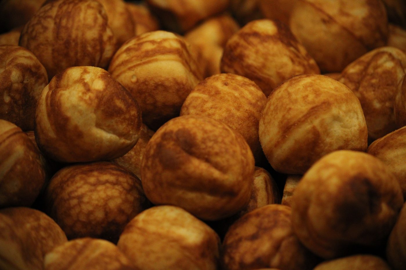 Æbleskiver — round Danish pancake balls dusted with powdered sugar, served with jam