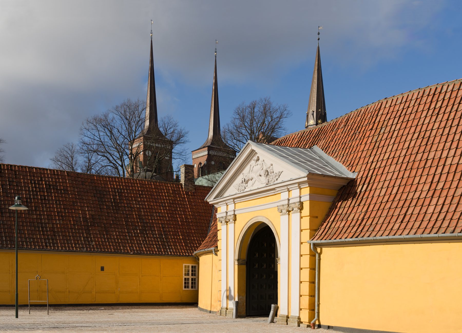 Roskilde Cathedral twin towers rising above the old town and Roskilde Fjord
