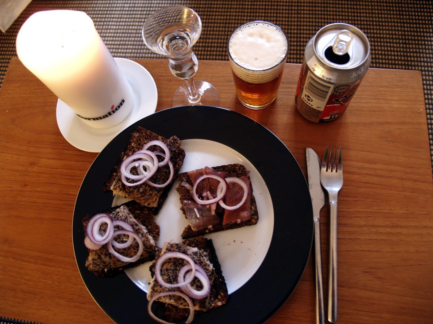 Pickled herring on Danish rugbrød — the classic julefrokost herring course