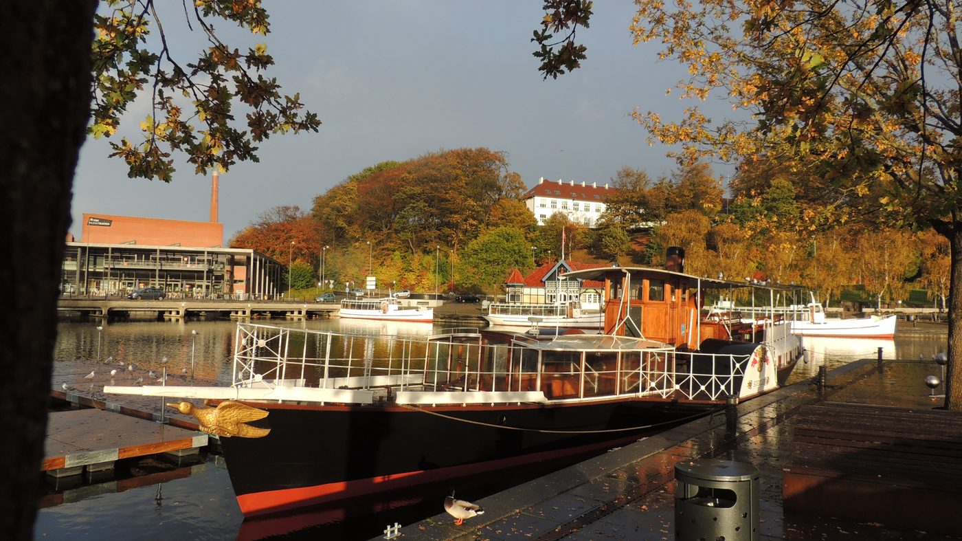 The Hjejlen paddle steamer moored at Silkeborg harbour, smoke wisping from the funnel