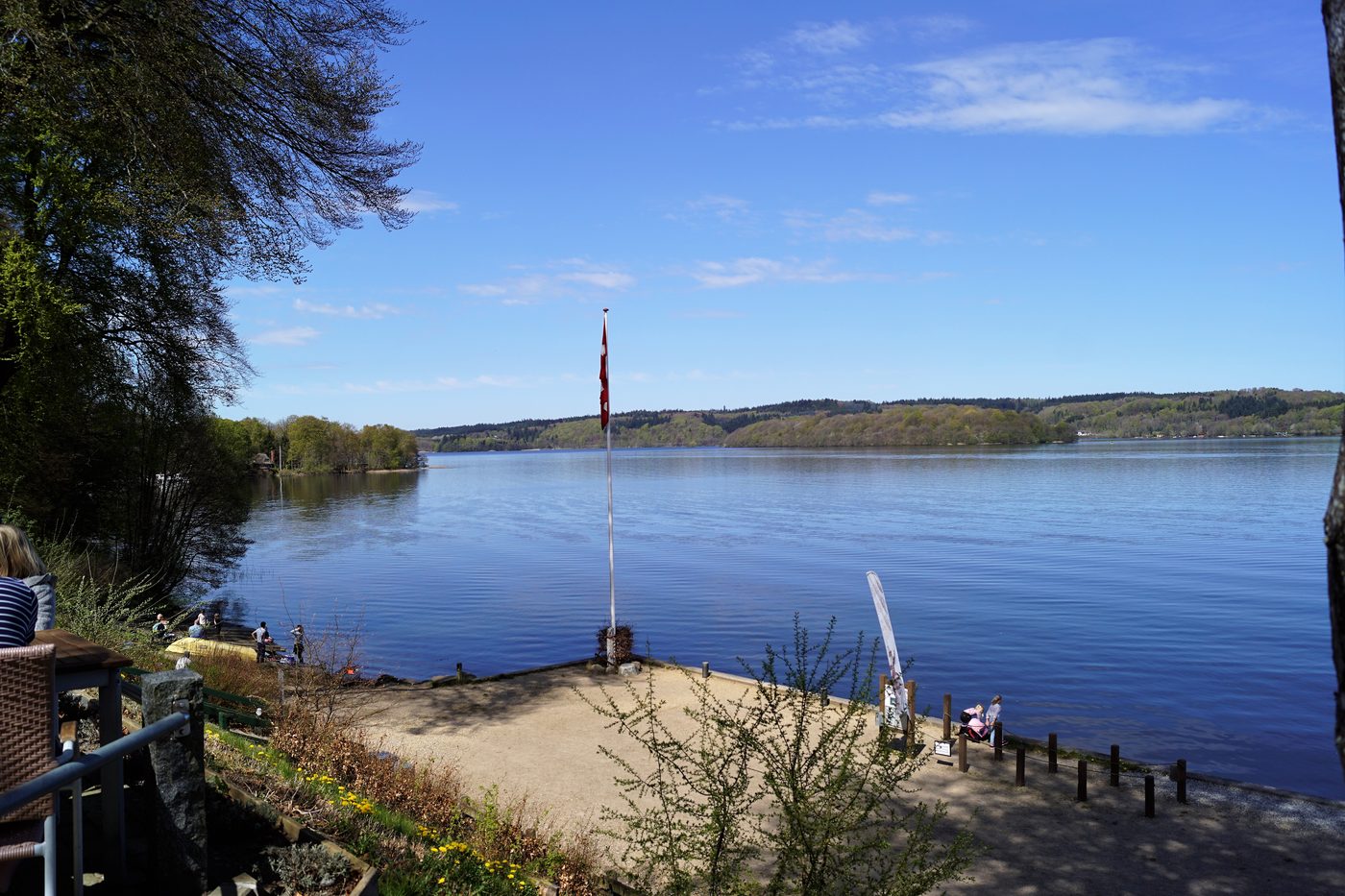 Julsø lake seen from Himmelbjerget — flat dark water framed by beech-covered hills