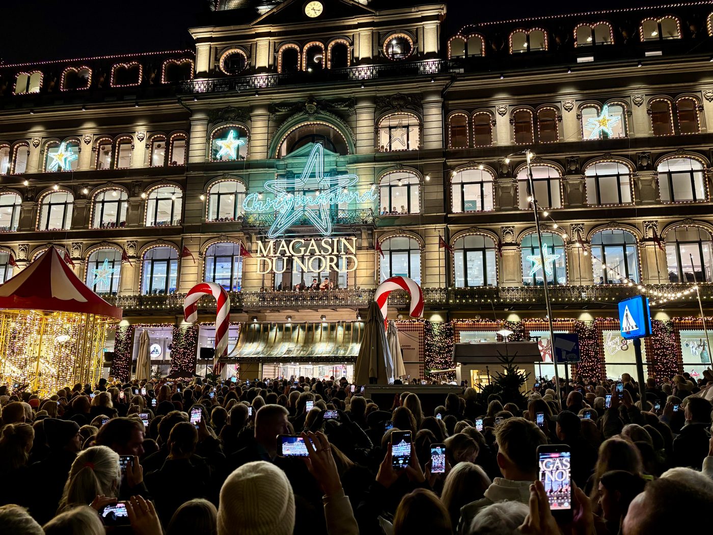 Magasin du Nord lit up with Christmas lights on Kongens Nytorv in central Copenhagen at dusk